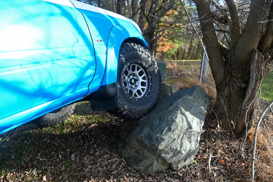 Front tire on rock showing clearance under the fender flare