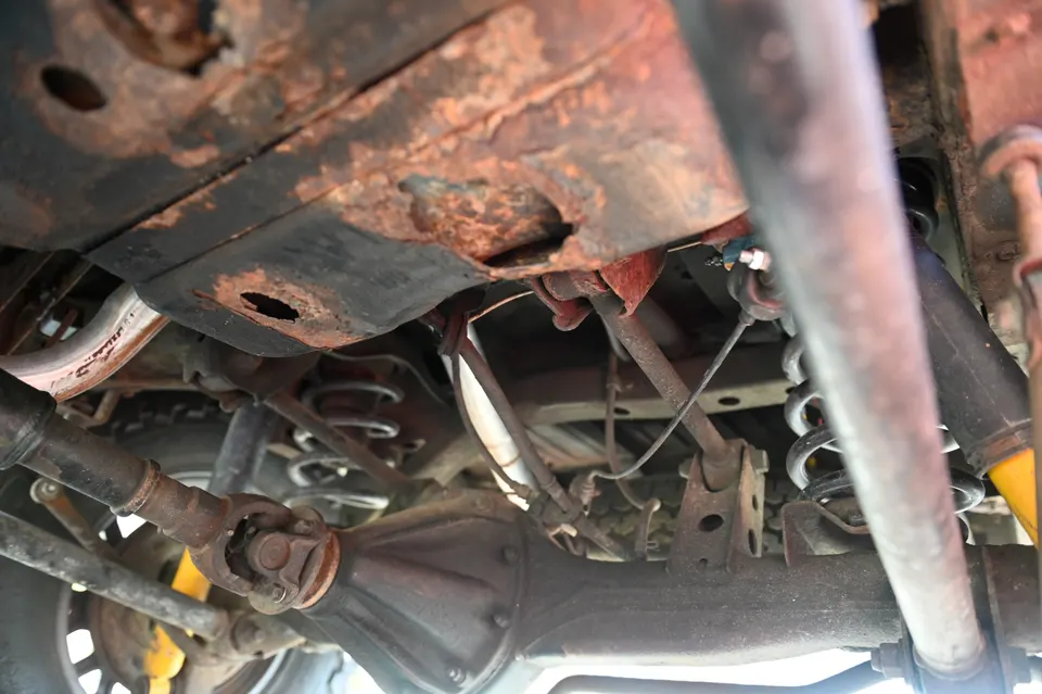 Fuel tank skid pan rust holes