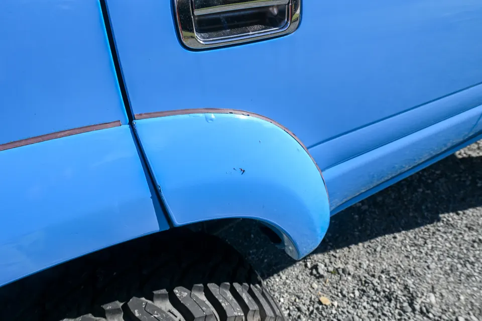 Paint chips on the rear passenger fender flare