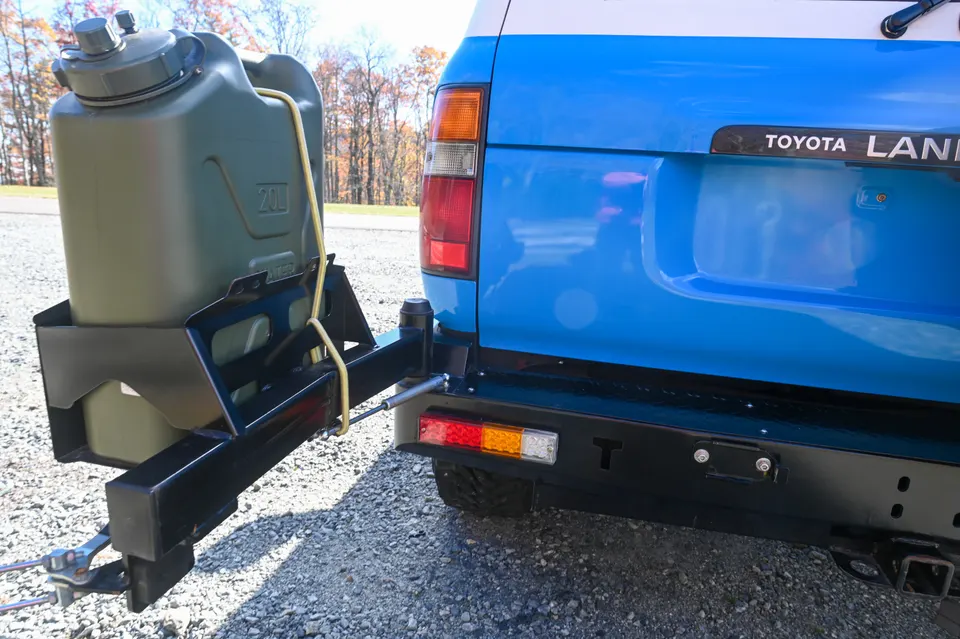 Rear tire carrier and jerry can