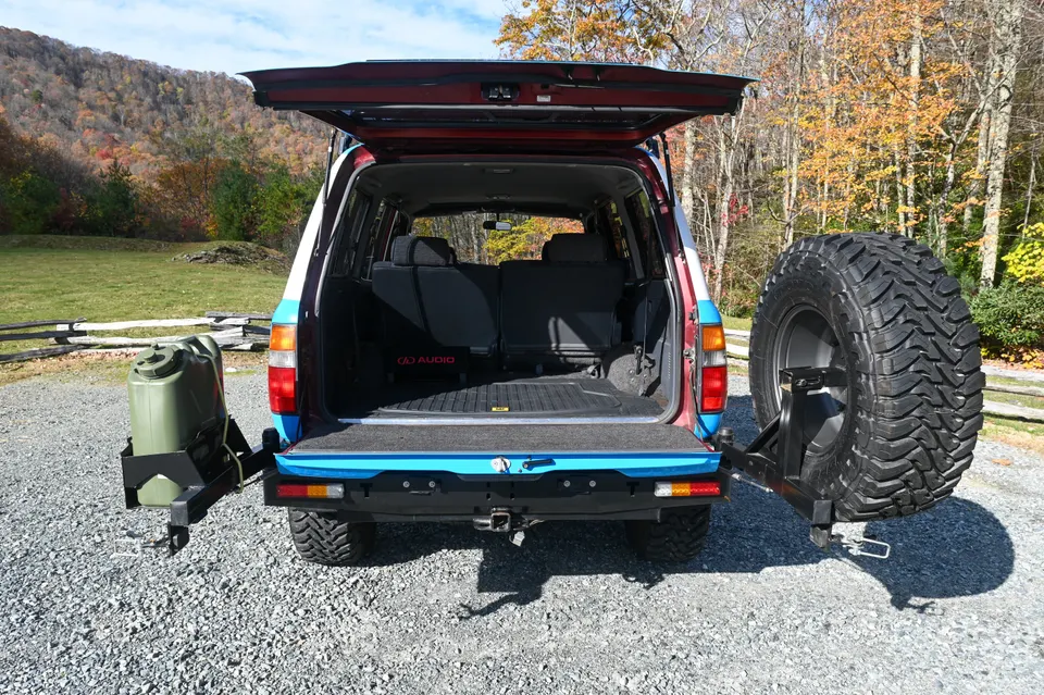 Rear tailgate open with spare carrier swung open